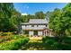 Charming two-story home with a screened-in porch and beautifully landscaped backyard oasis at 105 Juniper Ct, Carrboro, NC 27510
