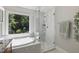 Beautiful bathroom with a soaking tub and luxurious glass shower at 105 Juniper Ct, Carrboro, NC 27510
