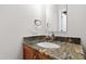 Half bath featuring a decorative granite countertop and lovely sink at 105 Juniper Ct, Carrboro, NC 27510