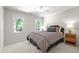 Cozy bedroom with two windows, a ceiling fan, and a Queen size bed at 105 Juniper Ct, Carrboro, NC 27510