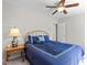 Bright bedroom with a queen size bed, ceiling fan, and natural light at 105 Juniper Ct, Carrboro, NC 27510