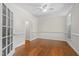 Spacious room with hardwood floors, crown molding, and a window to let in natural light at 105 Juniper Ct, Carrboro, NC 27510