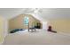 Large bonus room with carpeted floors, neutral paint, and fitness equipment at 105 Juniper Ct, Carrboro, NC 27510