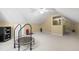 Spacious bonus room featuring carpeted floors, neutral paint, and fitness equipment at 105 Juniper Ct, Carrboro, NC 27510