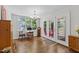 Charming breakfast nook with hardwood floors, natural light, and access to the outdoor deck at 105 Juniper Ct, Carrboro, NC 27510