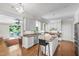 Open kitchen with granite countertops, modern appliances, and an island with seating at 105 Juniper Ct, Carrboro, NC 27510