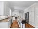 Spacious kitchen featuring granite countertops, a central island, and stainless steel appliances at 105 Juniper Ct, Carrboro, NC 27510