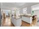 Open concept kitchen with granite island and connection to living and dining areas at 105 Juniper Ct, Carrboro, NC 27510
