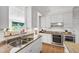 Modern kitchen with white cabinets, stainless steel appliances, and granite countertops at 105 Juniper Ct, Carrboro, NC 27510