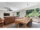 Bright and airy living room with large windows showcasing the landscaped backyard at 105 Juniper Ct, Carrboro, NC 27510