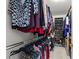 Walk-in closet with ample storage including hanging space and shoe racks at 105 Juniper Ct, Carrboro, NC 27510