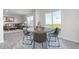 Bright breakfast nook with a round table, seating for four, and sliding glass doors that lead to the outdoors at 108 Reagan Crest Dr, Clayton, NC 27520