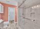 Modern bathroom showcases a glass shower enclosure with white marbled tile and niche at 11035 Southwalk Ln, Raleigh, NC 27614