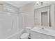 Bathroom featuring a white shower-tub combo, toilet, vanity, and mirror at 11035 Southwalk Ln, Raleigh, NC 27614