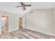 Open bedroom has neutral walls and wood look flooring, and a ceiling fan at 11035 Southwalk Ln, Raleigh, NC 27614