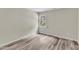 Bedroom featuring neutral walls, one window, and wood-look floors at 11035 Southwalk Ln, Raleigh, NC 27614