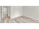 Bedroom featuring neutral walls, wood-look floors, and doorway at 11035 Southwalk Ln, Raleigh, NC 27614