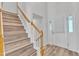 Bright entryway featuring wood-look flooring, staircase, and a white front door with sidelights at 11035 Southwalk Ln, Raleigh, NC 27614