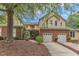 Charming two-story home featuring a brick foundation and attached two-car garage at 11035 Southwalk Ln, Raleigh, NC 27614