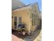 Back exterior featuring a brick patio, gas grill, and easy access to nature at 11035 Southwalk Ln, Raleigh, NC 27614