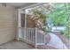 Covered porch with white railings offers a charming view at 11035 Southwalk Ln, Raleigh, NC 27614