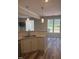 Open kitchen features a granite countertop bar with a stainless steel sink at 11035 Southwalk Ln, Raleigh, NC 27614