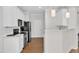 This kitchen features white cabinets, stainless steel appliances, and a breakfast bar at 11035 Southwalk Ln, Raleigh, NC 27614