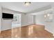 Spacious living room with large windows, light-colored walls, and tile floors at 11035 Southwalk Ln, Raleigh, NC 27614