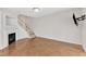 Bright living room featuring a fireplace, staircase, and neutral decor at 11035 Southwalk Ln, Raleigh, NC 27614