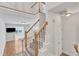 Open-concept living room with staircase and natural light at 11035 Southwalk Ln, Raleigh, NC 27614