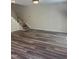 Spacious living room boasts beautiful laminate flooring and plenty of natural light at 11035 Southwalk Ln, Raleigh, NC 27614