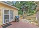 Back patio featuring brick flooring, grill, and backyard access at 11035 Southwalk Ln, Raleigh, NC 27614
