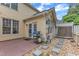 Back patio featuring brick flooring, grill, walkway, and backyard access at 11035 Southwalk Ln, Raleigh, NC 27614