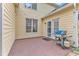 Back patio featuring brick flooring, grill, and house facade at 11035 Southwalk Ln, Raleigh, NC 27614