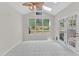 Bright sunroom with tile floors, a ceiling fan, and multiple windows for abundant natural light at 11035 Southwalk Ln, Raleigh, NC 27614