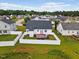 Aerial view of the backyard, featuring a trampoline and white fence in the neighborhood at 1104 Cross Creek Dr, Nashville, NC 27856