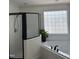 Bright bathroom with a glass block window above a soaking tub and a stand alone glass shower at 1104 Cross Creek Dr, Nashville, NC 27856