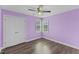 Cozy bedroom with hardwood floors, ceiling fan, and double windows for natural light at 1104 Cross Creek Dr, Nashville, NC 27856