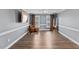 Large, empty bedroom with big windows, wood-look floors and neutral paint at 1104 Cross Creek Dr, Nashville, NC 27856