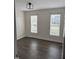 Bedroom featuring two large windows, wood-look flooring, and neutral paint to showcase natural light at 1104 Cross Creek Dr, Nashville, NC 27856