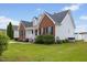 An eye-level side exterior view of a charming home with brick and vinyl siding at 1104 Cross Creek Dr, Nashville, NC 27856