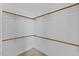 Walk-in closet with hanging rods and ample storage space at 1104 Cross Creek Dr, Nashville, NC 27856