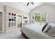 Bedroom featuring a bed, a desk, and a large window with natural light and a ceiling fan at 112 Roseberry Way, Holly Springs, NC 27540