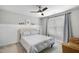 Bedroom featuring carpet, ceiling fan, a window with curtains, and a bed at 112 Roseberry Way, Holly Springs, NC 27540