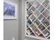 Bookcase with built-in shelving and an assortment of books and a picture on the wall at 112 Roseberry Way, Holly Springs, NC 27540