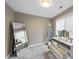 This dressing room includes a full-length mirror, vanity, and storage, offering both style and functionality at 112 Roseberry Way, Holly Springs, NC 27540