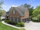 Well-maintained brick house with a three car garage and landscaped yard at 112 Roseberry Way, Holly Springs, NC 27540