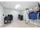 Finished game room with two gaming stations and a Pop-A-Shot basketball game at 112 Roseberry Way, Holly Springs, NC 27540