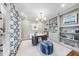 Well-lit home office with custom built-ins, decorative accents, and a comfortable workspace at 112 Roseberry Way, Holly Springs, NC 27540