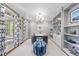 Comfortable home office with lots of shelving, natural light, and a chic, functional workspace at 112 Roseberry Way, Holly Springs, NC 27540